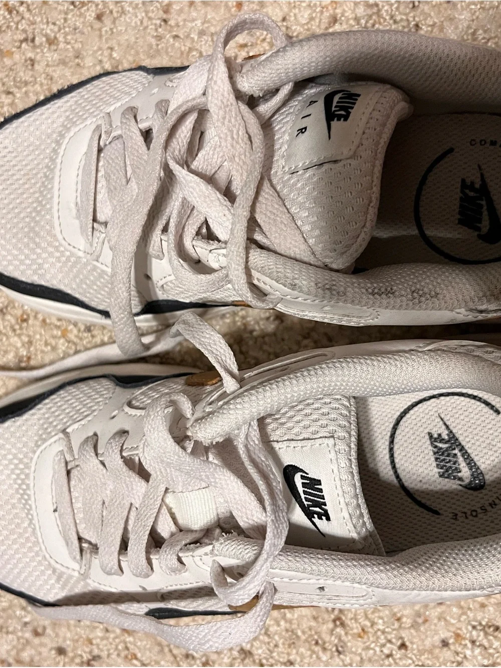 Nike White and Black Mesh Sneakers with Gold Swoosh
